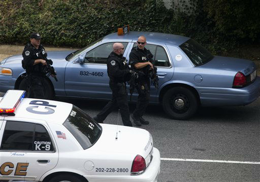 Capitol Hill police officers respond to a shooting on Capitol Hill in Washington, Thursday, Oct. 3, 2013. Police say the U.S. Capitol has been put on a security lockdown amid reports of possible shots fired outside the building.