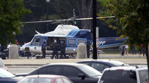 A U.S. Park Police helicopter is loaded on the...