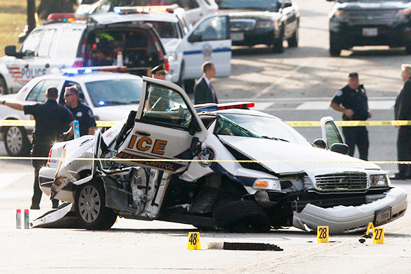 A wrecked Capitol Police car blocks Constitution...