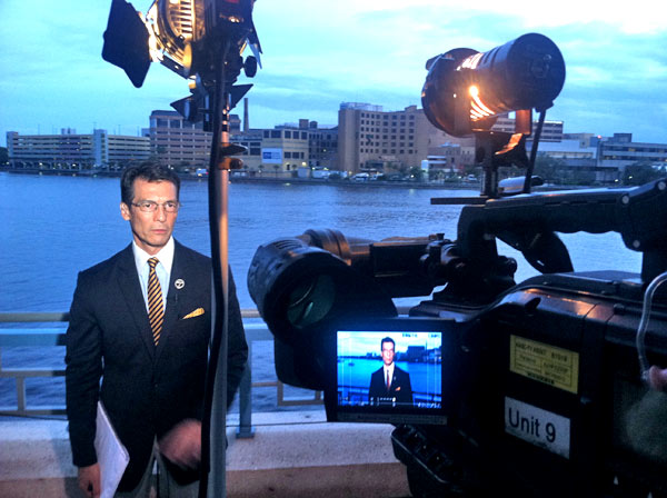 David Ono of ABC7 Eyewitness News prepares for a...
