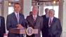 President Barack Obama stands at a podium with former President Bill Clinton immediately to his left in this undated file photo.