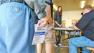 A man is seen holding his sample ballot on Tuesday, Nov. 6, 2012.