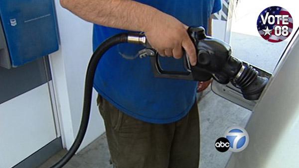 Man pumps gasoline.