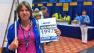 Regine Sediva of Chino Hills poses in front of the check-in desk at the Boston Marathon.