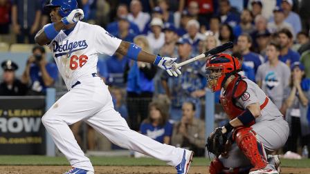 Los Angeles Dodgers Yasiel Puig hits an RBI single during the fourth inning of Game 4 of the National League baseball championship series against the St. Louis Cardinals Tuesday, Oct. 15, 2013, in Los Angeles.
