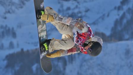 United States Sage Kotsenburg takes a jump during the mens snowboard slopestyle semifinal at the Rosa Khutor Extreme Park, at the 2014 Winter Olympics, Saturday, Feb. 8, 2014, in Krasnaya Polyana, Russia.