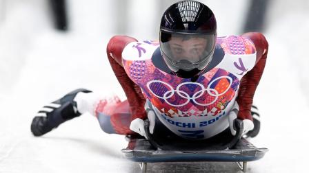 Martins Dukurs of Latvia brakes avert his third run during the mens skeleton competition at the 2014 Winter Olympics, Saturday, Feb. 15, 2014, in Krasnaya Polyana, Russia.