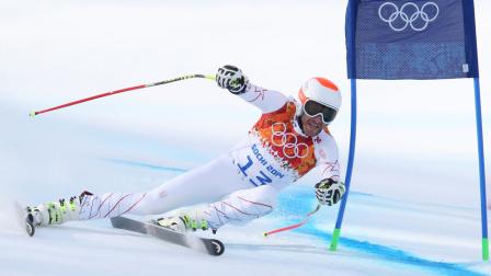United States Bode Miller passes a gate in the mens super-G at the Sochi 2014 Winter Olympics, Sunday, Feb. 16, 2014, in Krasnaya Polyana, Russia.