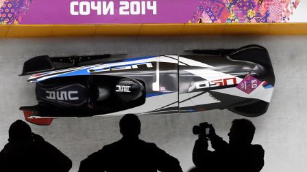 The team from the United States USA-2, piloted by Jamie Greubel with brakeman Aja Evans, take a curve on their third run during the womens bobsled competition at the 2014 Winter Olympics, Wednesday, Feb. 19, 2014, in Krasnaya Polyana, Russia.
