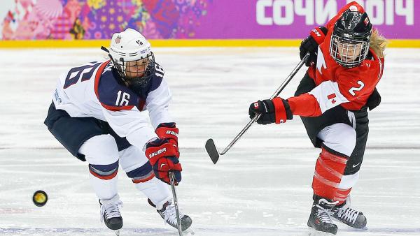 Meghan Agosta-Marciano of Canada (2) shoots against Kelli Stack of the United States (16) during the first period of the women's gold medal ice hockey game at the 2014 Winter Olympics, Thursday, Feb. 20, 2014, in Sochi, Russia.