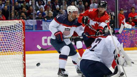 Canada forward Benn Jamie, right, shoots and scores against USA goaltender Jonathan Quick during the second period of a mens semifinal ice hockey game at the 2014 Winter Olympics, Friday, Feb. 21, 2014, in Sochi, Russia.