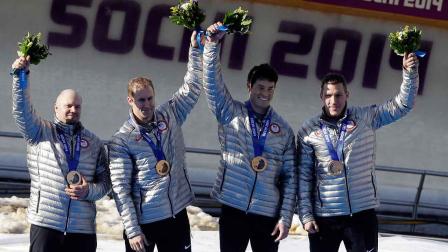 The team from the United States USA-1 celebrate after they won the bronze medals in the mens four-man bobsled competition final at the 2014 Winter Olympics, Sunday, Feb. 23, 2014, in Krasnaya Polyana, Russia.