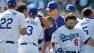 Los Angeles Dodgers Matt Kemp, center, is mobbed at the plate after he hits a game winning two-run home run to beat the St. Louis Cardinals during the ninth inning of a baseball game in Los Angeles, Sunday, April 17, 2011.