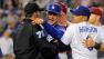Los Angeles Dodgers manager Don Mattingly, center, yells at members of the Arizona Diamondbacks after starting pitcher Zack Greinke was hit by a pitch during the seventh inning of their baseball game, Tuesday, June 11, 2013, in Los Angeles.