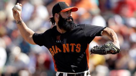 In this March 14, 2012 file photo, San Francisco Giants relief pitcher Brian Wilson throws to the Cleveland Indians during the fifth inning of a spring training baseball game in Scottsdale, Ariz.