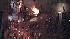 A car is set on fire as crowds riot in L.A....