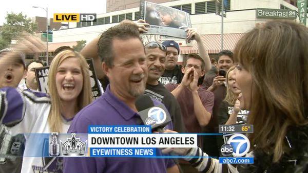 A Los Angeles Kings fan speaks with ABC7 reporter Jovana Lara before the Stanley Cup victory parade on Thursday, June 14, 2012.