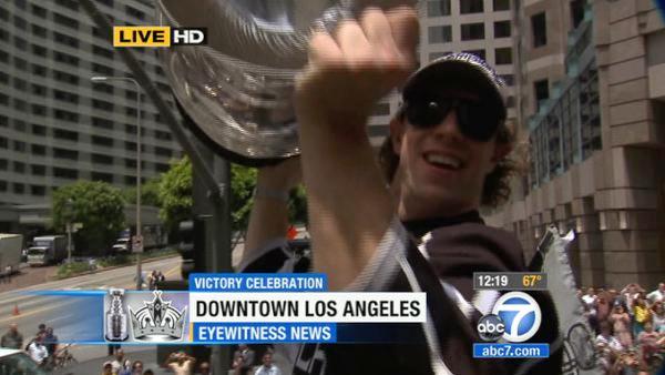 Los Angeles Kings' Anze Kopitar hoists the Stanley Cup during a parade celebrating the team's NHL hockey Stanley Cup championship in Los Angeles, Thursday, June 14, 2012.