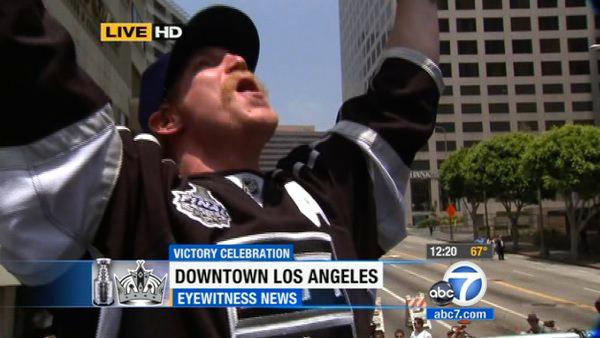 Los Angeles Kings' Matt Greene cheers during a parade celebrating the team's NHL hockey Stanley Cup championship in Los Angeles, Thursday, June 14, 2012.