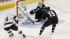 San Jose Sharks goalie Antti Niemi (31), blocks a goal attempt against Los Angeles Kings left wing Dustin Penner (25) as Sharks center James Sheppard (15) defends in Game 3 of their second-round NHL hockey Stanley Cup playoff series, May 18, 2013.
