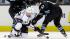 Los Angeles Kings center Trevor Lewis (22) battles against San Jose Sharks center Tommy Wingels (57) and center Scott Gomez (23) during the first period in Game 4 of the Western Conference semifinals Tuesday, May 21, 2013.