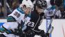 San Jose Sharks center Logan Couture (39) and Los Angeles Kings right wing Dustin Brown (23) fight for the puck during the third period in Game 5 of the Western Conference semifinals Thursday, May 23, 2013, in Los Angeles.