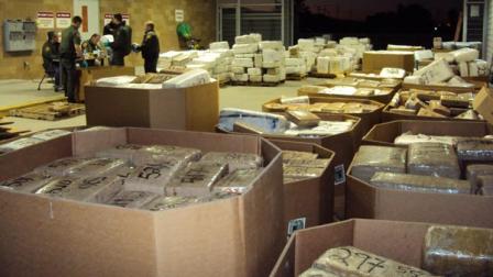 Federal authorities said they arrested eight people and seized more than 20 tons of marijuana after discovering a sophisticated drug tunnel that links a San Diego-area building to a home in Mexico.