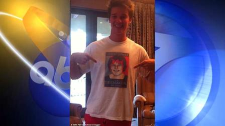 Patrick Schwarzenegger points to the image of his younger brother, Christopher, who was badly injured while boogie boarding. The older brother tweeted Sunday, July 24, 2011 that his brother was doing a lot better and posted this photo to whosay.com.