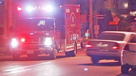 An ambulance rushes to the scene of a hard landing of a Navy helicopter at North Island Naval Air Station on Coronado on Wednesday, Dec. 12, 2012.
