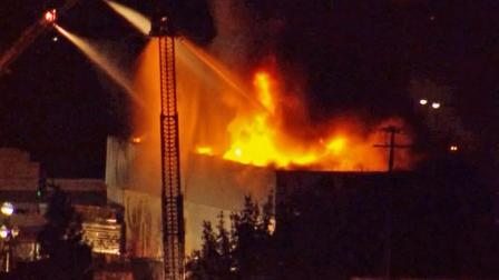 Fire crews douse the Original Pepperbelly Comedy and Variety Theater in Fairfield, Calif. on Friday, Jan. 25, 2013.