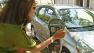 Commuter Tamara Nadarajah deals with a broken parking meter in this 2013 photo.