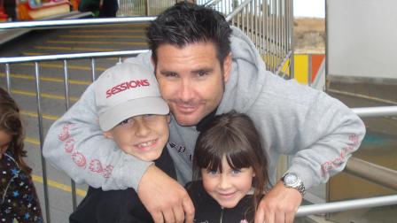 This undated image provided Tuesday April 5, 2011 by John Stow shows Bryan Stow holding his son and daughter.