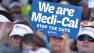 Sign carrying demonstrators representing doctors, hospitals and unionized health care workers rallied against a 10 percent cut in the amount the state pays for Medi-Cal reimbursements, at the Capitol in Sacramento, Calif., Tuesday, June 4, 2013.