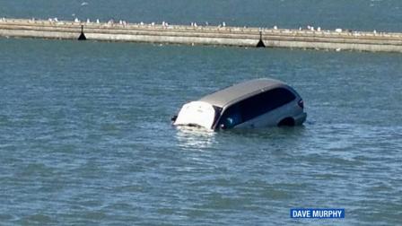 A van sinks in the San Francisco Bay after the driver drove the vehicle off a curb near the San Francisco Marina Yacht Harbor on Friday, June 21, 2013.