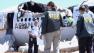 National Transportation Safety Board investigators are shown at the scene of the Asiana Airlines crash at San Francisco International Airport.