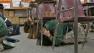Students cover their heads during an earthquake drill in this undated file photo.