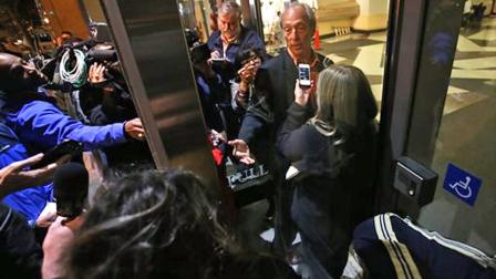 BART lead negotiator Thomas P. Hock, right, talks with members of the media as he enters Caltrans offices during negotiations with BART management and union members on Thursday, Oct. 10, 2013 in Oakland, Calif.