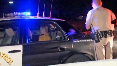 Chula Vista Fire Department engineer Jacob Gregoire is shown in the back of a police cruiser after he was detained by a CHP officer on Tuesday, Feb. 4, 2014.