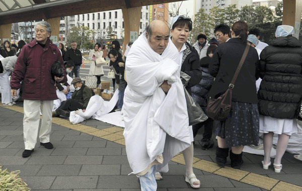 Patients and nurses evacuated from a hospital...