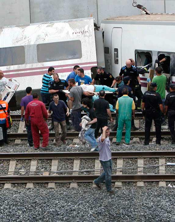 A wounded passenger is evacuated by emergency...