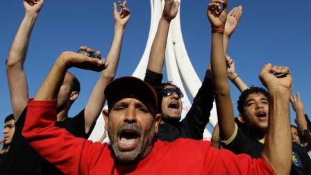 Bahraini protesters celebrates at the Pearl roundabout soon after the military pulled out in Manama, Bahrain, Saturday, Feb. 19, 2011.
