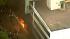 A fire burned at a parking structure during a...