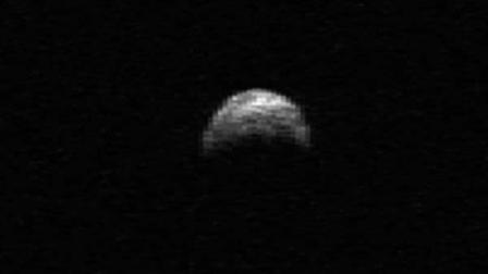 NASA scientists are tracking an asteroid bigger than an aircraft carrier that will fly by between the Earth and moon Tuesday.