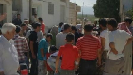 A crowd of people gather on a street in Syria in this July 2012 photo. On Sunday, July, 15, 2012, the international Red Cross officially declared the conflict in Syria a civil war.