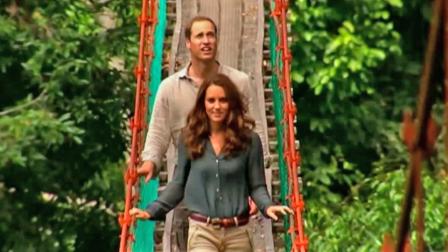 Prince William appears with his wife Kate as they walk through a bridge while touring Asia in the summer of 2012.