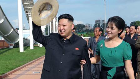 In this July 25, 2012 file photo released by the Korean Central News Agency and distributed in Tokyo by the Korea News Service, North Korean leader Kim Jong Un, accompanied by his wife Ri Sol Ju, waves to the crowd.