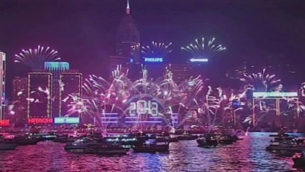 Fireworks explode at the Hong Kong Convention and Exhibition Centre over the Victoria Harbor in Hong Kong Tuesday, Jan. 1, 2013