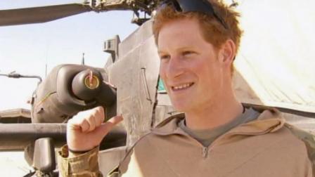 In this photo taken Dec. 12, 2012, made available Monday Jan. 21, 2013 of Britains Prince Harry talks to a TV crew after making his early morning pre-flight checks on the flight-line, from Camp Bastion southern Afghanistan.