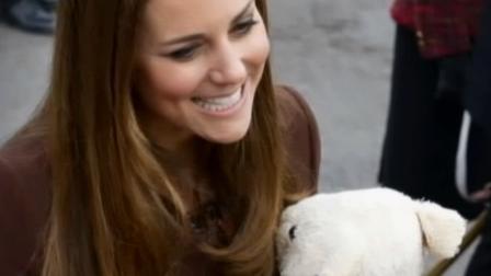 Britains Kate Duchess of Cambridge is given a teddy bear by a young member of the public as she arrives in the fishing port town of Grimsby, England on March 5, 2013.