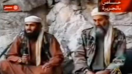 This still from a video aired on Oct. 7, 2001, shows al Qaeda spokesman Suleiman Abu Ghaith, left, speaking while sitting next to Osama bin Laden at an undisclosed location in Afghanistan.
